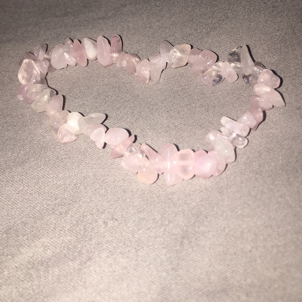 A light pink stone bracelet.